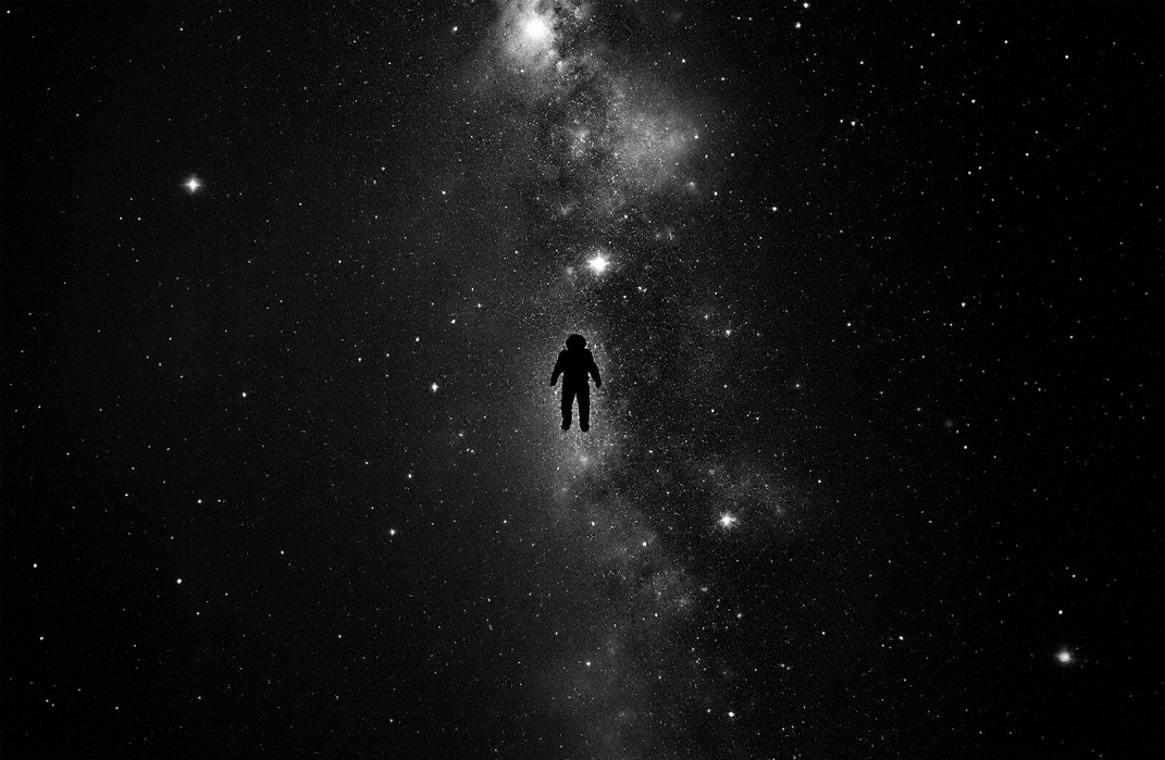A solitary figure in a spacesuit, adrift in the infinite expanse of the cosmos.